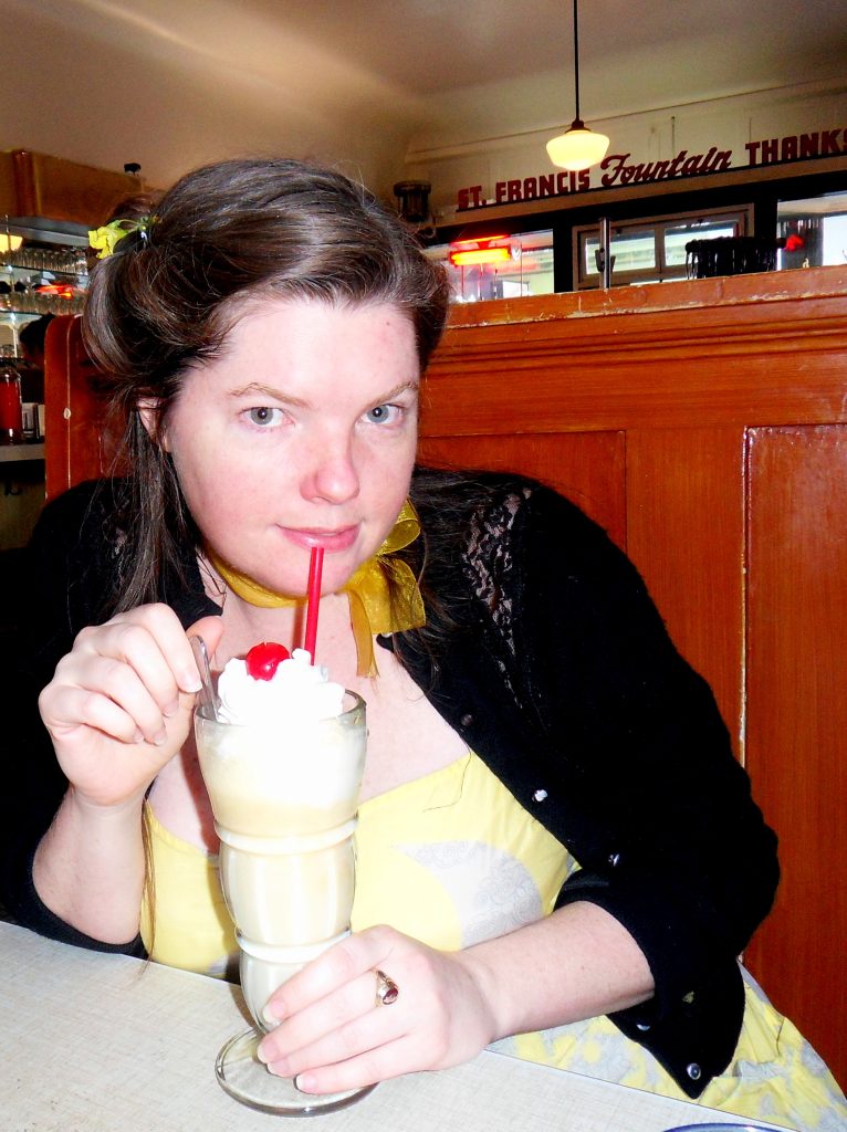 Karma Bennett drinking a milshake at St. Francis Fountain in San Francisco